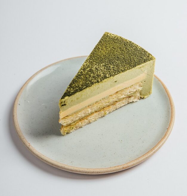 Matcha Yuzu cake slice served on a plate