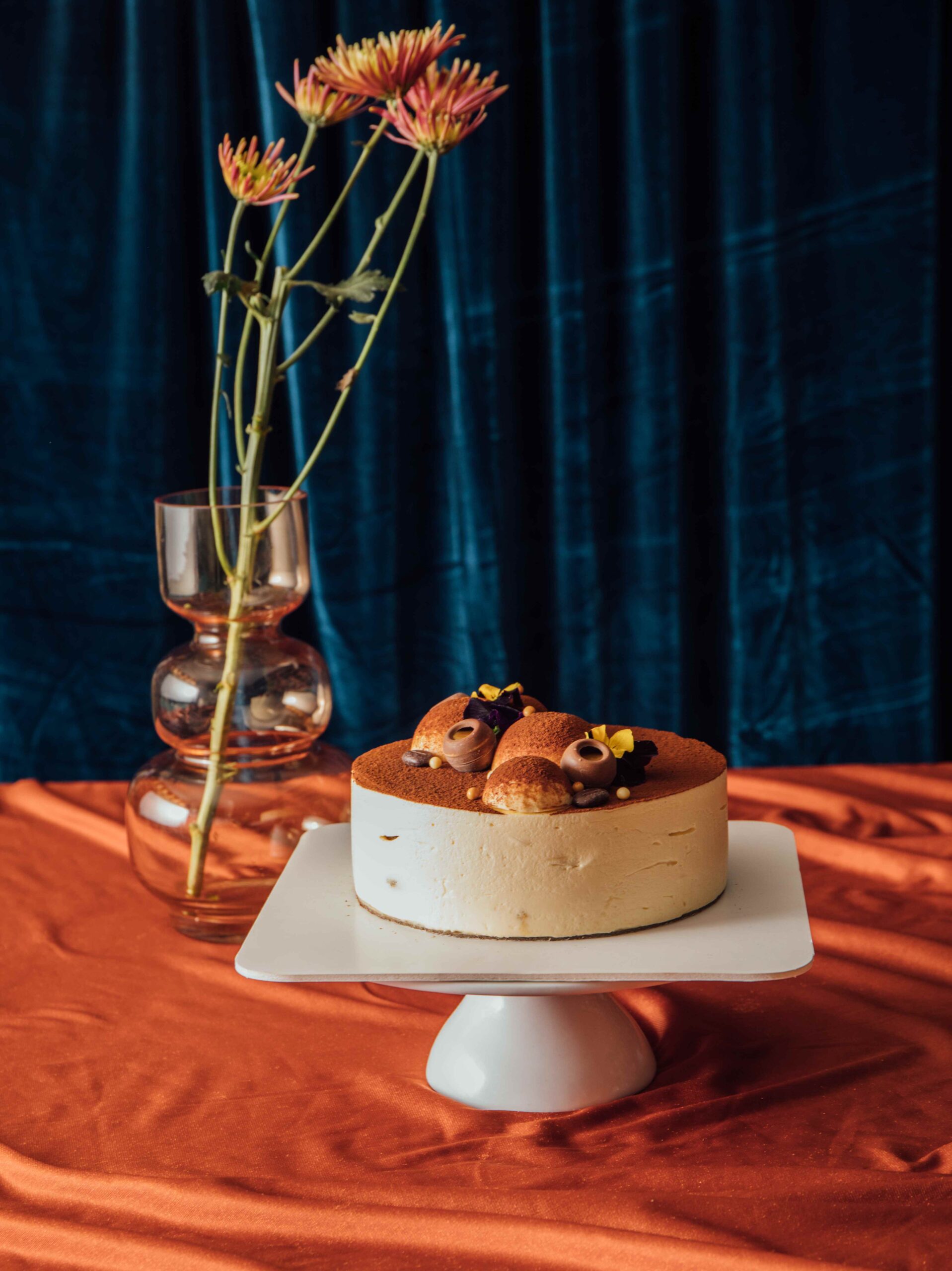 Tiramisu cake on a decorative cake tray