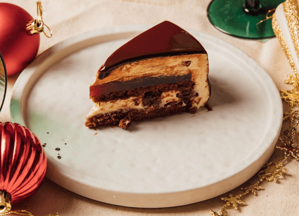 A slice of Black Forest cake is displayed on a plate