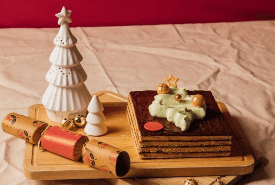 A delicious gluten-free cake presented on a rustic wooden plate
