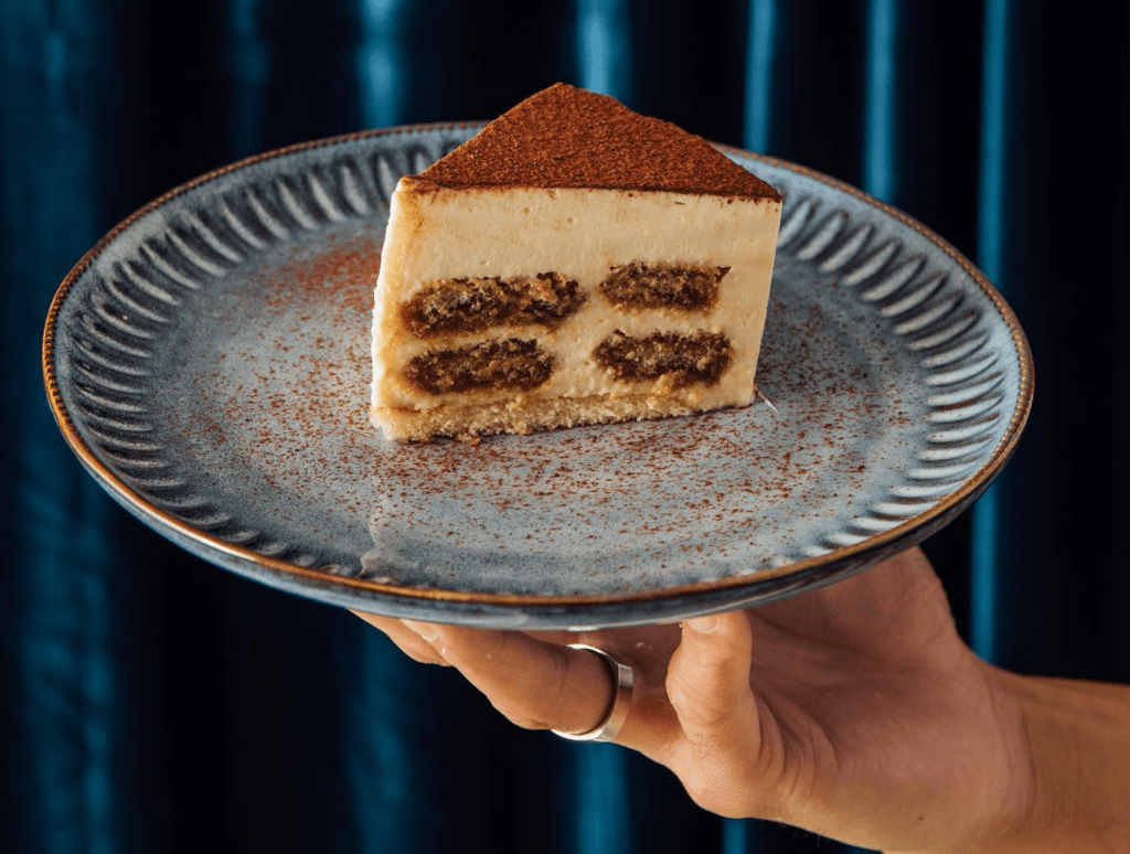 Tiramisu cake slice on a plate