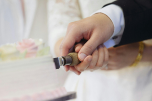 A joyful wedding cake cutting moment