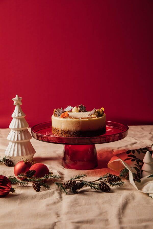 Vegan Carrot Cake Cheesecake with red colour background