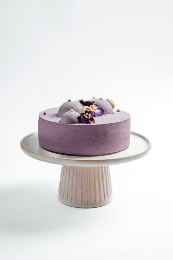 Ube cream cheese cake with white colour background