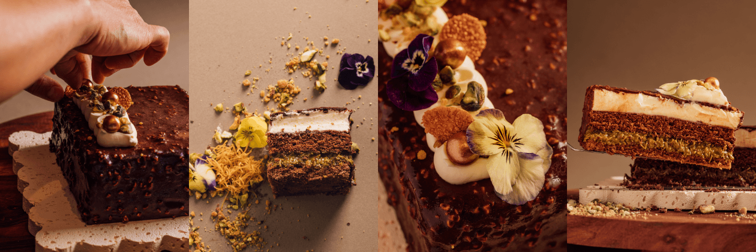 Hand cutting chocolate cake with flowers and pistachios on top.
